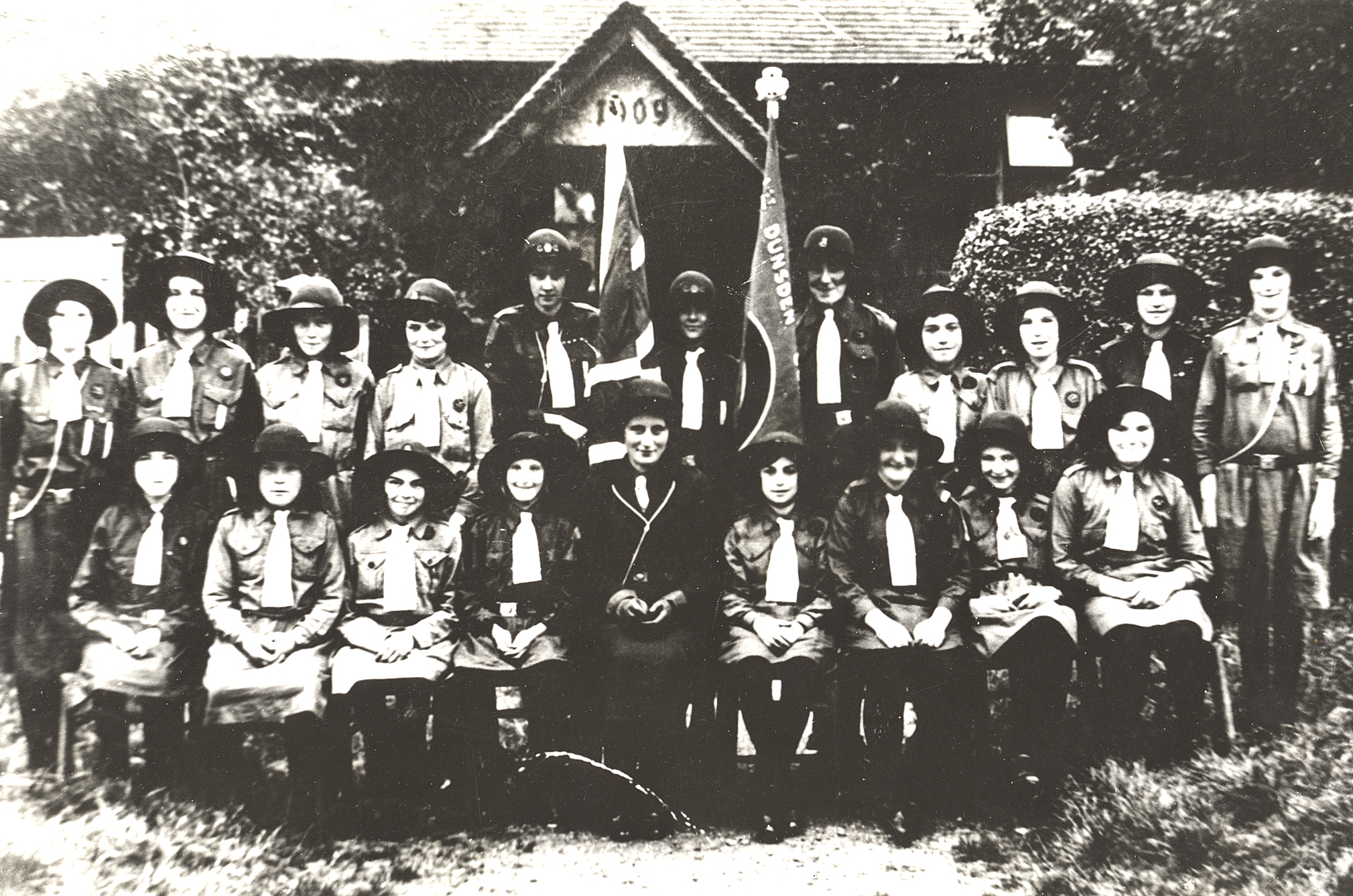 Historic image of guides outside the old village hall